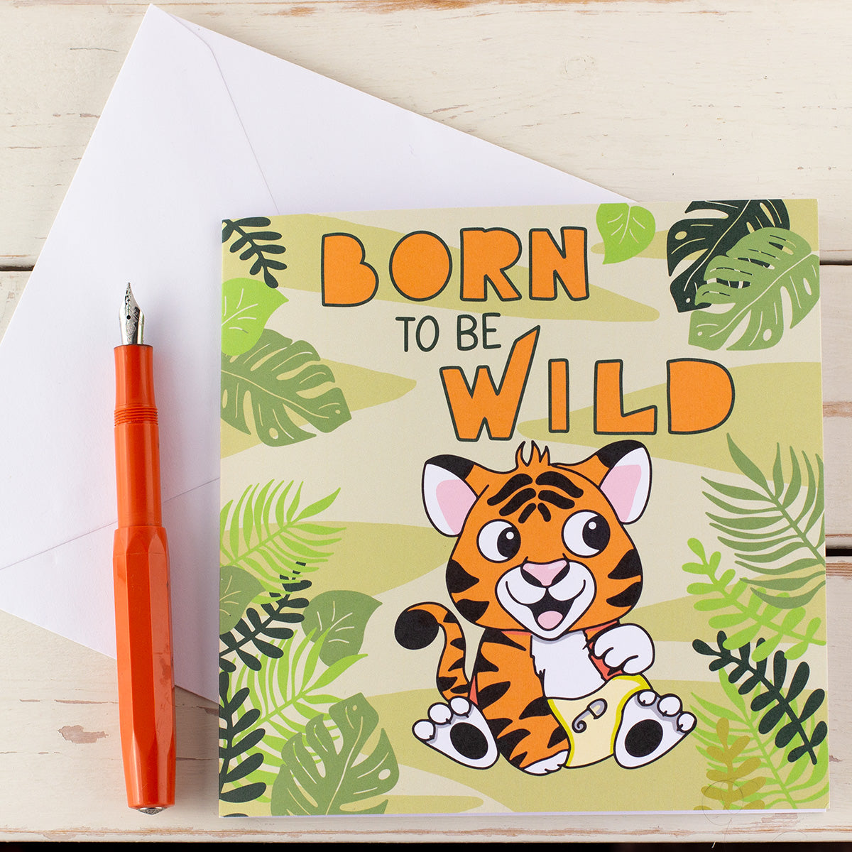 New Baby card with a cute tiger cub wearing a nappy in the jungle with the words born to be wild.