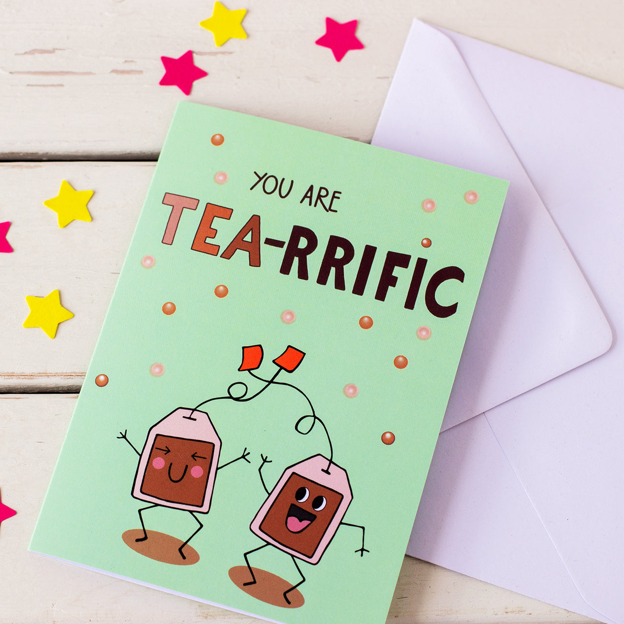 illustrated card of happy, dancing tea bags with words You Are Tea-Rrffic with white envelope. Illustration by fizzi~jayne. fizzy jane 
