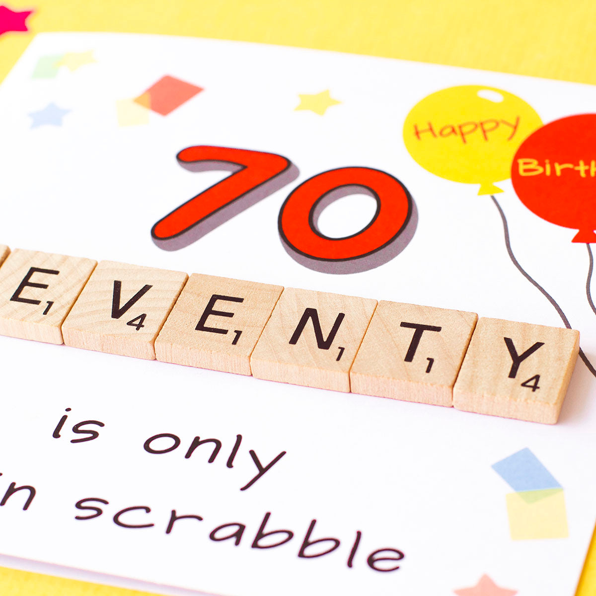 Close up of the wooden scrabble tiles. 70 is only 13 in scrabble. 70th Birthday Card by fizzijayne