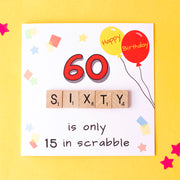 60 is only 15 in Scrabble. Illustrated with Party balloons and confetti and hand finished with Wooden scrabble tiles 60th Birthday Card - image on a yellow background -fizzi~jayne
