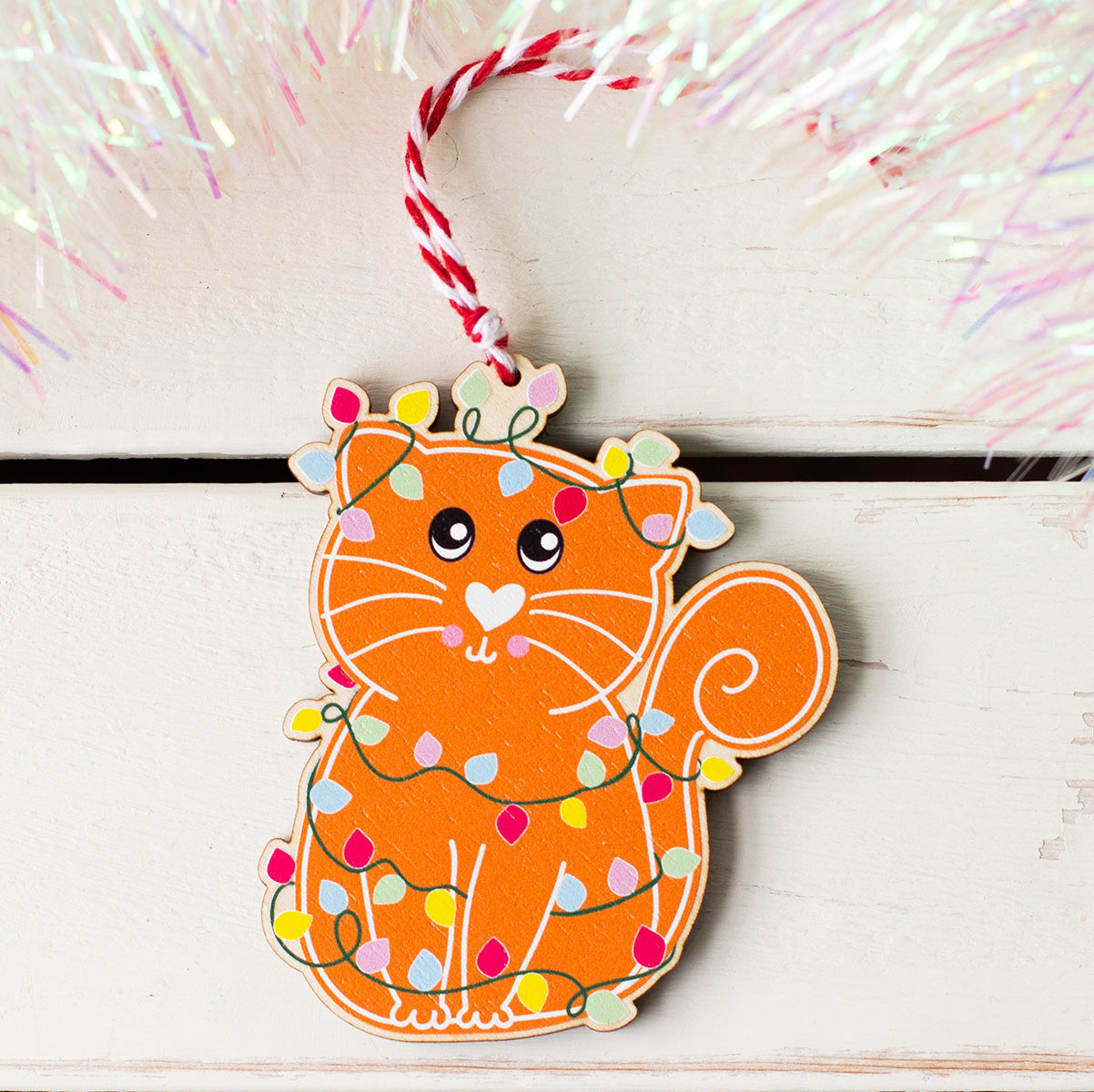 Gingerbread style cat wooden Christmas decoration with red and white twine