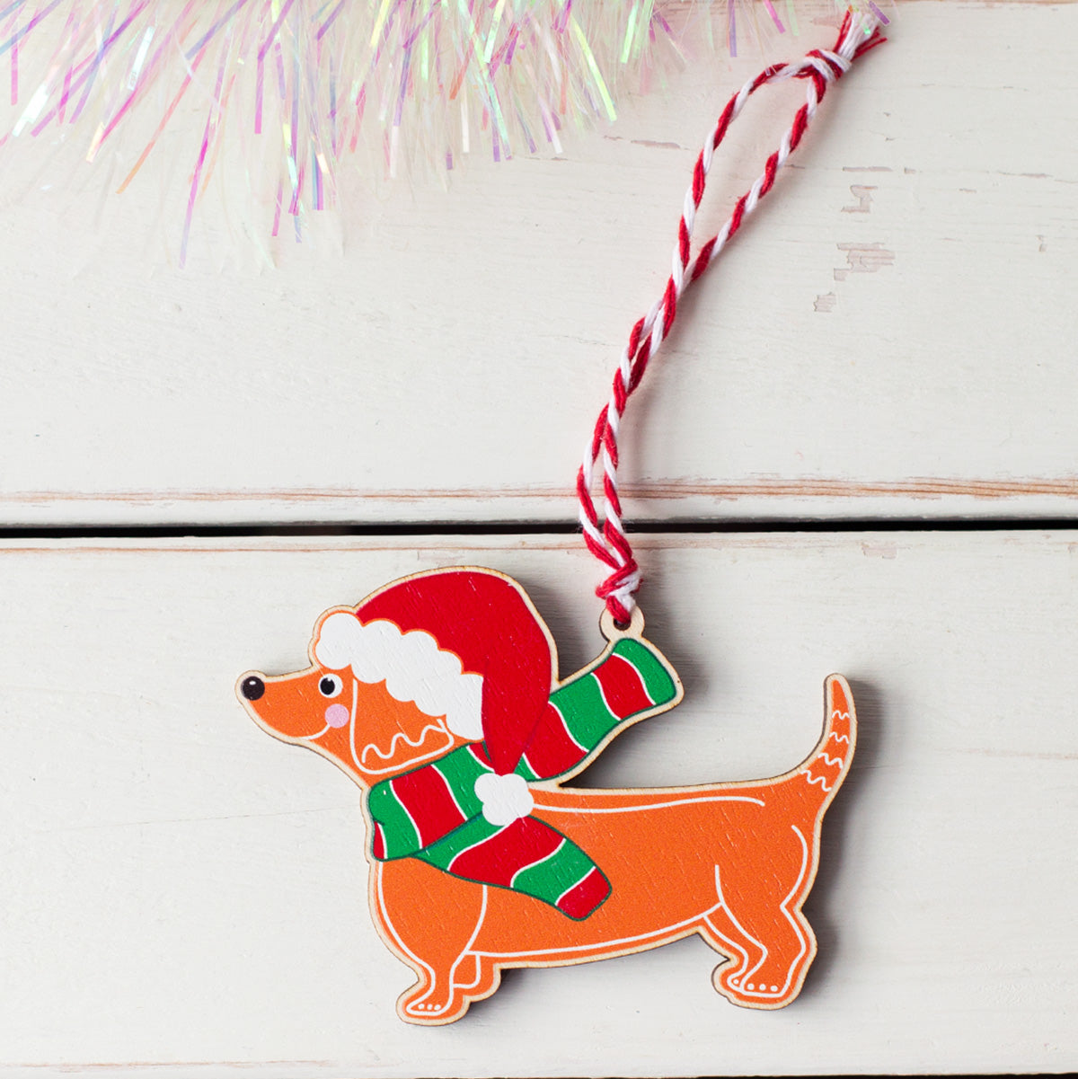 gingerbread dachshund sausage dog in Santa hat and scarf wooden tree decoration